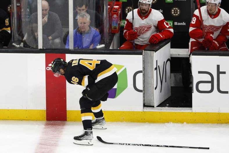 Oct 27, 2022; Boston, Massachusetts, USA; Boston Bruins center David Krejci (46) hunches over and leaves the ice after being injured against the Detroit Red Wings during the second period at TD Garden. Mandatory Credit: Winslow Townson-USA TODAY Sports