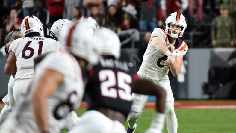 Oct 27, 2022; Raleigh, North Carolina, USA; Virginia Tech Hokies quarterback Grant Wells (6) throws a pass during the first half against the North Carolina State Wolfpack at Carter-Finley Stadium. Mandatory Credit: Rob Kinnan-USA TODAY Sports