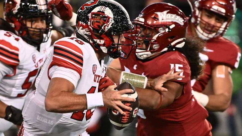 Oct 27, 2022; Pullman, Washington, USA; Utah Utes quarterback Bryson Barnes (16) breaks away from Washington State Cougars defensive lineman Nusi Malani (15) in the first half at Gesa Field at Martin Stadium. Mandatory Credit: James Snook-USA TODAY Sports