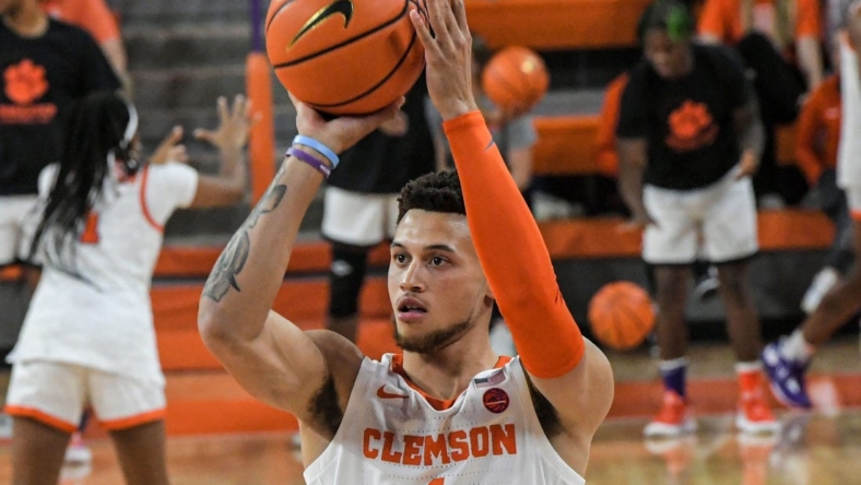 Clemson junior guard Chase Hunter (1) participates in a three-point competition during Rock the John basketball season kickoff event at Littlejohn Coliseum in Clemson, S.C. Thursday, October 27, 2022.

Rock The John Basketball Season Kickoff Event