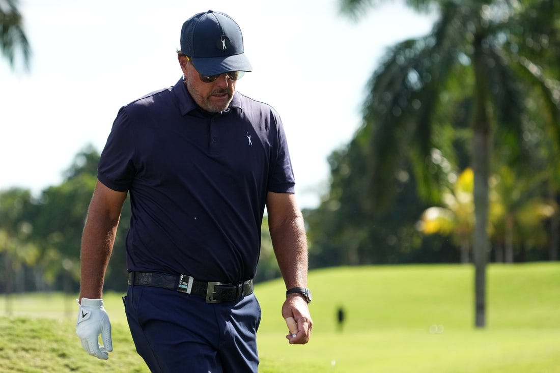 Oct 28, 2022; Miami, Florida, USA; Phil Mickelson walks down the fairway of the second hole during the first round of the season finale of the LIV Golf series at Trump National Doral. Mandatory Credit: Jasen Vinlove-USA TODAY Sports