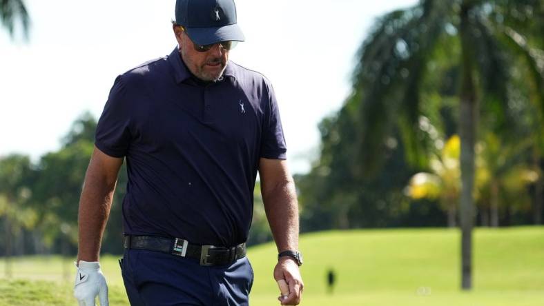 Oct 28, 2022; Miami, Florida, USA; Phil Mickelson walks down the fairway of the second hole during the first round of the season finale of the LIV Golf series at Trump National Doral. Mandatory Credit: Jasen Vinlove-USA TODAY Sports