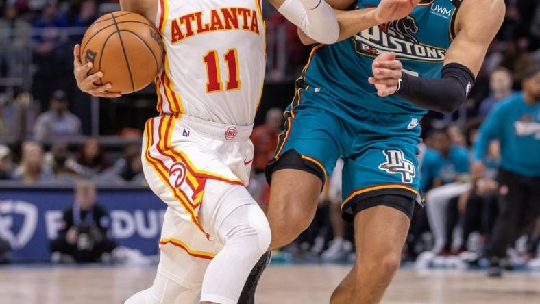 Oct 28, 2022; Detroit, Michigan, USA; Detroit Pistons guard Cade Cunningham (2) defends against Atlanta Hawks guard Trae Young (11) during the first half at Little Caesars Arena. Mandatory Credit: David Reginek-USA TODAY Sports