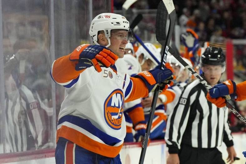 Oct 28, 2022; Raleigh, North Carolina, USA;  New York Islanders right wing Josh Bailey (12) celebrates his goal against the Carolina Hurricanes during the second period at PNC Arena. Mandatory Credit: James Guillory-USA TODAY Sports