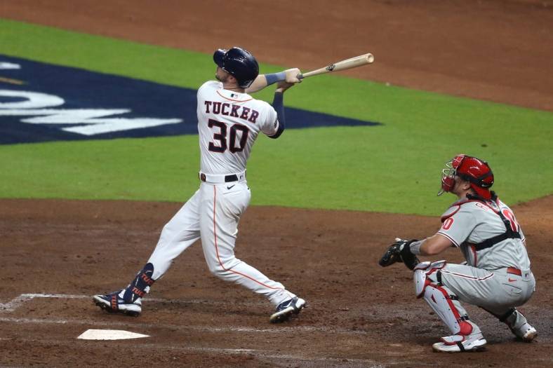 Oct 28, 2022; Houston, Texas, USA; Houston Astros right fielder Kyle Tucker (30) hits a three-run home run during the third inning against the Philadelphia Phillies in game one of the 2022 World Series at Minute Maid Park. Mandatory Credit: Thomas Shea-USA TODAY Sports