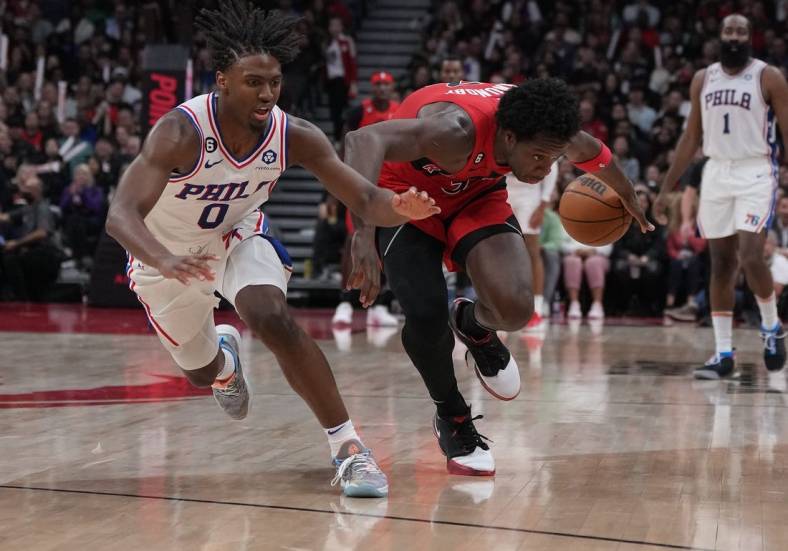 Oct 28, 2022; Toronto, Ontario, CAN; Philadelphia 76ers guard Tyrese Maxey (0) plays for the ball with Toronto Raptors forward O.G. Anunoby (3) during the fourth quarter at Scotiabank Arena. Mandatory Credit: Nick Turchiaro-USA TODAY Sports