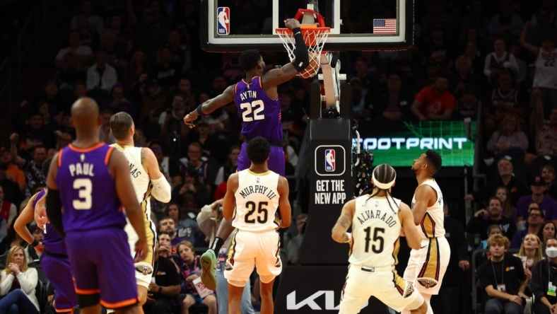 Oct 28, 2022; Phoenix, Arizona, USA; Phoenix Suns center Deandre Ayton (22) dunks for the basket against the New Orleans Pelicans during the first half at Footprint Center. Mandatory Credit: Mark J. Rebilas-USA TODAY Sports