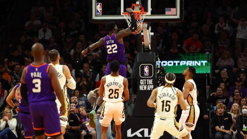 Oct 28, 2022; Phoenix, Arizona, USA; Phoenix Suns center Deandre Ayton (22) dunks for the basket against the New Orleans Pelicans during the first half at Footprint Center. Mandatory Credit: Mark J. Rebilas-USA TODAY Sports