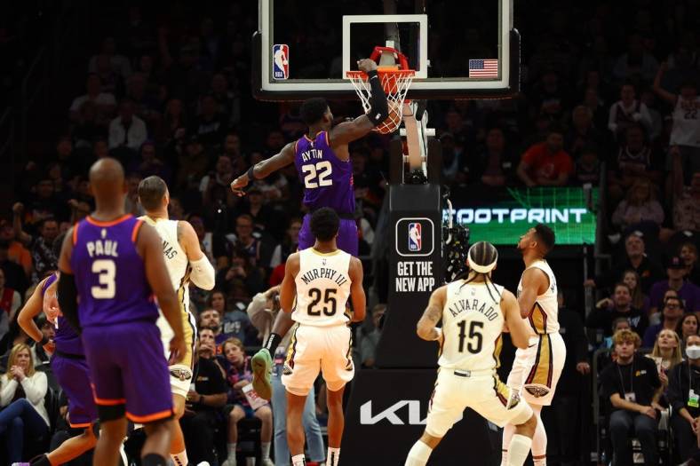 Oct 28, 2022; Phoenix, Arizona, USA; Phoenix Suns center Deandre Ayton (22) dunks for the basket against the New Orleans Pelicans during the first half at Footprint Center. Mandatory Credit: Mark J. Rebilas-USA TODAY Sports