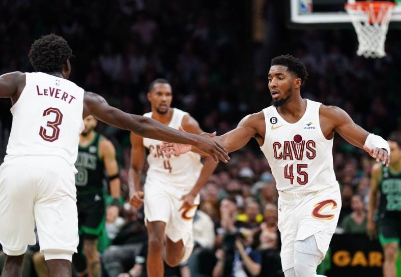 Oct 28, 2022; Boston, Massachusetts, USA; Cleveland Cavaliers guard Donovan Mitchell (45) reacts with guard Caris LeVert (3) against the Boston Celtics in the second half at TD Garden. Mandatory Credit: David Butler II-USA TODAY Sports