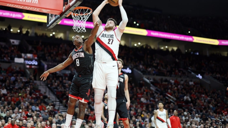 Oct 28, 2022; Portland, Oregon, USA; Portland Trail Blazers center Jusuf Turkic (27) comes down with a rebound next to Houston Rockets small forward Jae'Sean Tate (8) during the first half at Moda Center. Mandatory Credit: Soobum Im-USA TODAY Sports