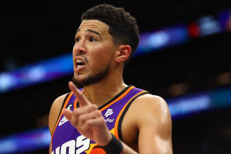 Oct 28, 2022; Phoenix, Arizona, USA; Phoenix Suns guard Devin Booker (1) reacts against the New Orleans Pelicans during the second half at Footprint Center. Mandatory Credit: Mark J. Rebilas-USA TODAY Sports