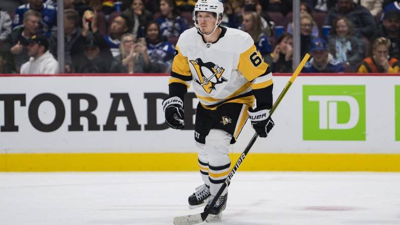 Oct 28, 2022; Vancouver, British Columbia, CAN; Pittsburgh Penguins forward Rickard Rakell (67) celebrates his goal  against the Vancouver Canucks in the second period at Rogers Arena.  Mandatory Credit: Bob Frid-USA TODAY Sports