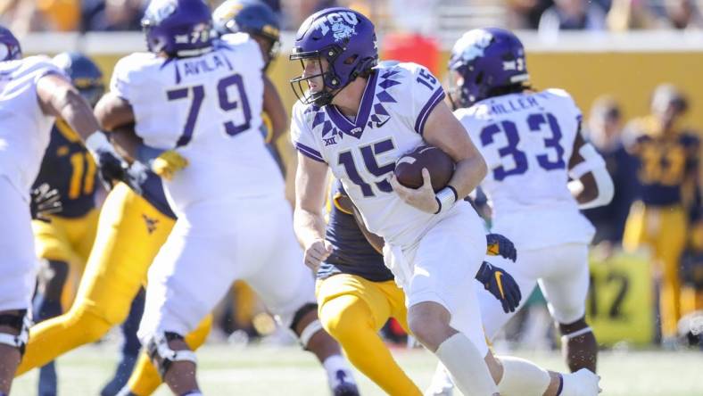 Oct 29, 2022; Morgantown, West Virginia, USA; TCU Horned Frogs quarterback Max Duggan (15) runs the ball during the first quarter against the West Virginia Mountaineers at Mountaineer Field at Milan Puskar Stadium. Mandatory Credit: Ben Queen-USA TODAY Sports