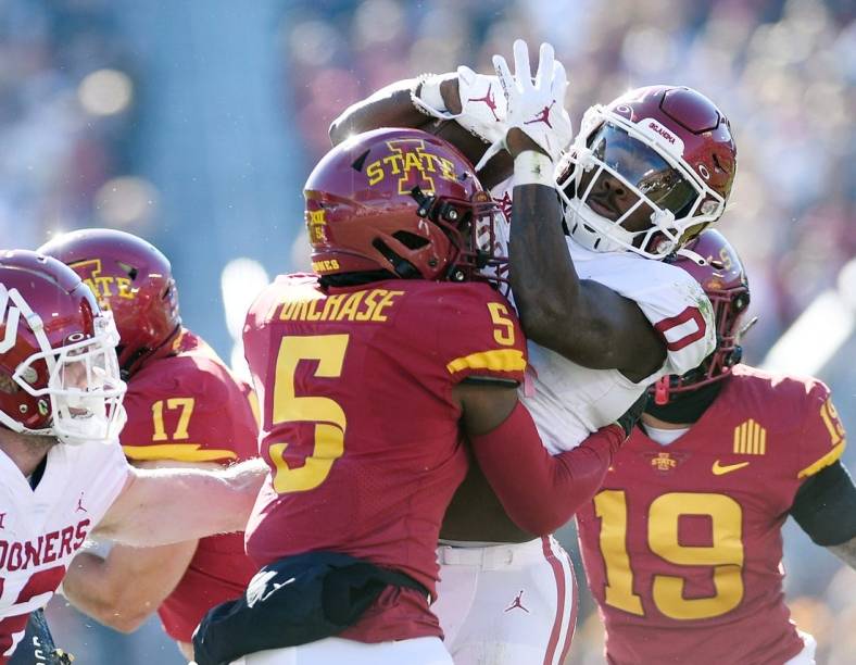 Oct 29, 2022; Ames, Iowa, USA;  Iowa State Cyclones defensive back Myles Purchase (5) knocks the ball out from Oklahoma Sooners running back Eric Gray (0) during the first quarter in the Big 12 Conference game  at Jack Trice Stadium. Mandatory Credit: Nirmalendu Majumdar/Ames Tribune-USA TODAY Sports