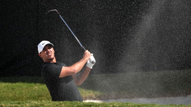 Oct 29, 2022; Miami, Florida, USA; Brooks Koepka plays his shot from the bunker on the 16th hole during the second round of the season finale of the LIV Golf series at Trump National Doral. Mandatory Credit: Jasen Vinlove-USA TODAY Sports