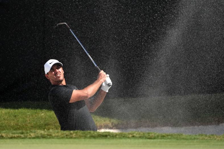 Oct 29, 2022; Miami, Florida, USA; Brooks Koepka plays his shot from the bunker on the 16th hole during the second round of the season finale of the LIV Golf series at Trump National Doral. Mandatory Credit: Jasen Vinlove-USA TODAY Sports
