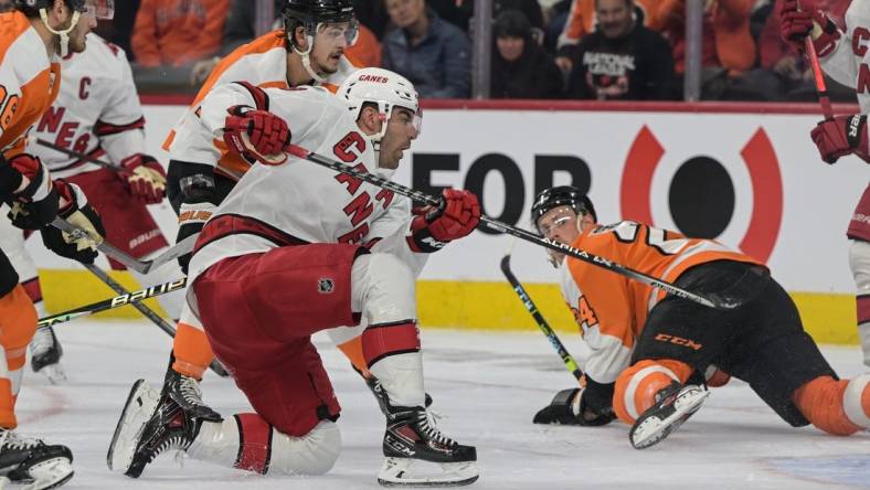 Oct 29, 2022; Philadelphia, Pennsylvania, USA;  Carolina Hurricanes left wing Jordan Martinook (48) shoots and scores against the Philadelphia Flyers during the first period at the Wells Fargo Center. Mandatory Credit: John Geliebter-USA TODAY Sports