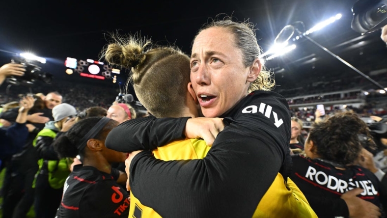 Oct 29, 2022; Washington, D.C., USA; Portland Thorns FC defender Meghan Klingenberg (25) celebrates with Portland Thorns FC goalkeeper Bella Bixby (1) after defeating the Kansas City Current in the NWSL championship game at Audi Field. Mandatory Credit: Brad Mills-USA TODAY Sports