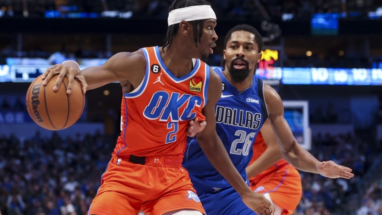 Oct 29, 2022; Dallas, Texas, USA;  Oklahoma City Thunder guard Shai Gilgeous-Alexander (2) controls the ball as Dallas Mavericks guard Spencer Dinwiddie (26) defends during the second quarter at American Airlines Center. Mandatory Credit: Kevin Jairaj-USA TODAY Sports