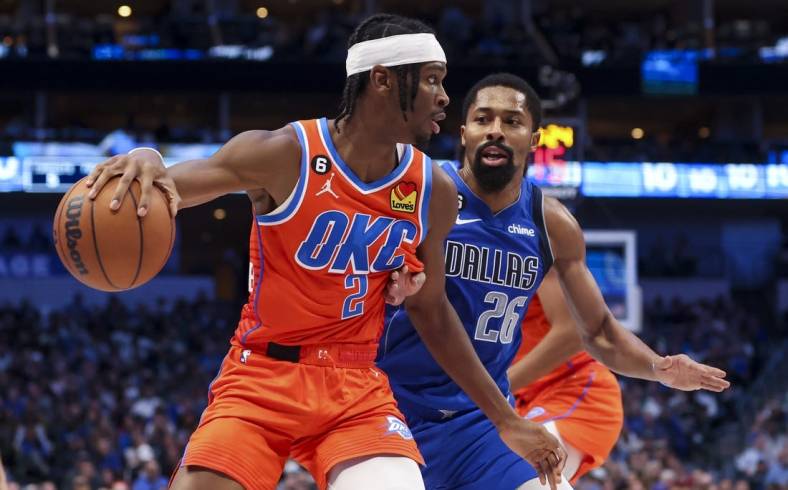 Oct 29, 2022; Dallas, Texas, USA;  Oklahoma City Thunder guard Shai Gilgeous-Alexander (2) controls the ball as Dallas Mavericks guard Spencer Dinwiddie (26) defends during the second quarter at American Airlines Center. Mandatory Credit: Kevin Jairaj-USA TODAY Sports
