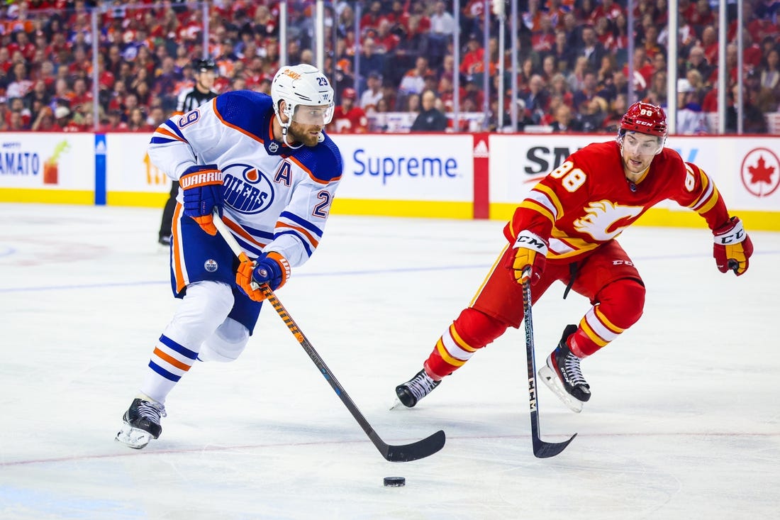 Oilers fight back to beat Flames, extend winning streak