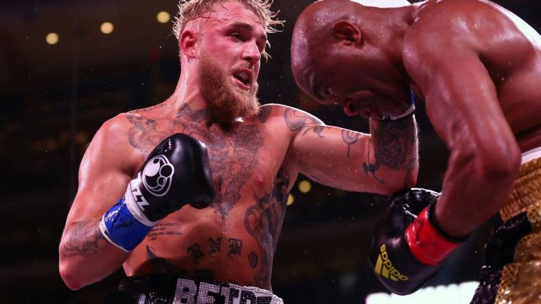 Oct 29, 2022; Glendale, Arizona, USA;  Jake Paul lands a hit against Anderson Silva at Desert Diamond Arena. Mandatory Credit: Mark J. Rebilas-USA TODAY Sports