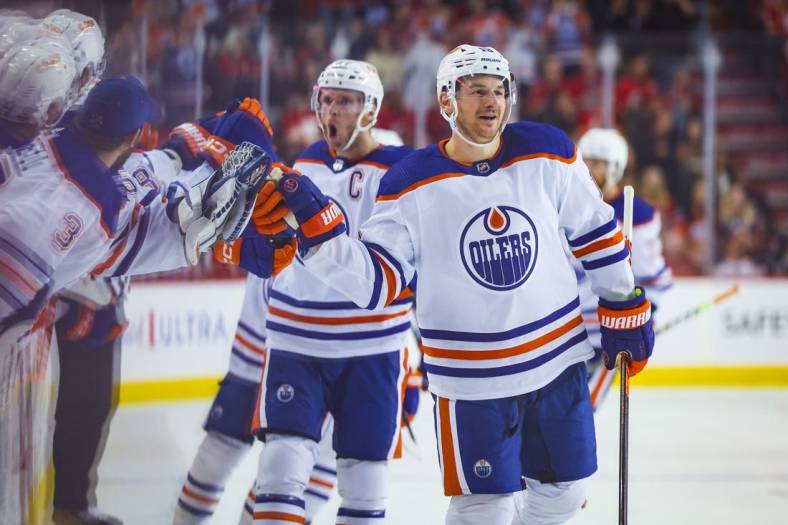 Oct 29, 2022; Calgary, Alberta, CAN; Edmonton Oilers left wing Zach Hyman (18) celebrates his goal with teammates against the Calgary Flames during the third period at Scotiabank Saddledome. Mandatory Credit: Sergei Belski-USA TODAY Sports