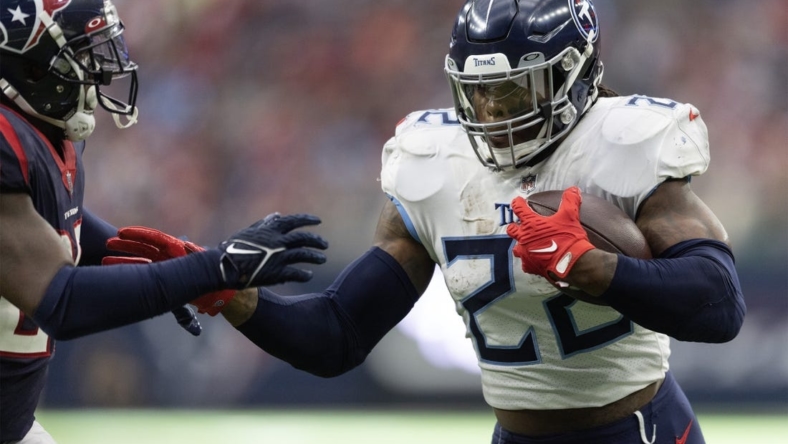 Oct 30, 2022; Houston, Texas, USA; Tennessee Titans running back Derrick Henry (22) rushes for a touchdown against Houston Texans cornerback Desmond King II (25) in the second quarter at NRG Stadium. Mandatory Credit: Thomas Shea-USA TODAY Sports