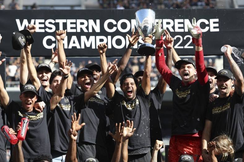 Oct 30, 2022; Los Angeles, California, USA; Los Angeles FC forward Carlos Vela (10) holds the cup as the Los Angeles FC celebrate the win over the Austin FC during the conference finals for the Audi 2022 MLS Cup Playoffs at Banc of California Stadium. Mandatory Credit: Kiyoshi Mio-USA TODAY Sports