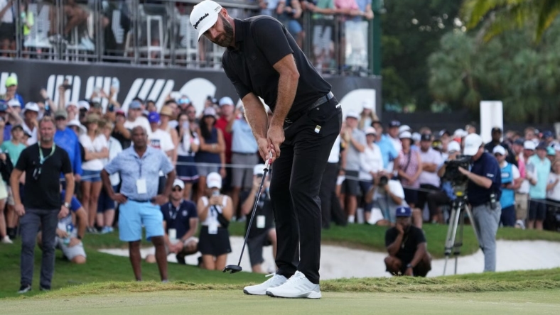 Oct 30, 2022; Miami, Florida, USA; Dustin Johnson putts on the 18th green during the final round of the season finale of the LIV Golf series at Trump National Doral. Mandatory Credit: Jasen Vinlove-USA TODAY Sports