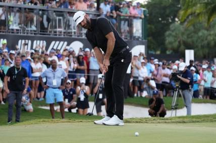 Oct 30, 2022; Miami, Florida, USA; Dustin Johnson putts on the 18th green during the final round of the season finale of the LIV Golf series at Trump National Doral. Mandatory Credit: Jasen Vinlove-USA TODAY Sports