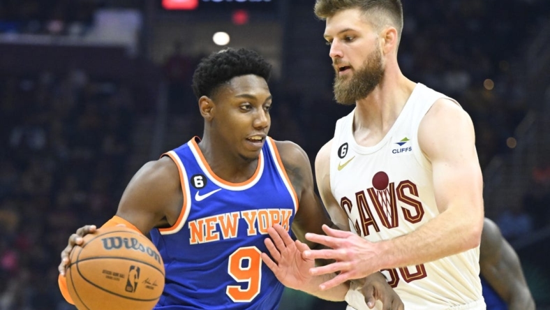 Oct 30, 2022; Cleveland, Ohio, USA; Cleveland Cavaliers forward Dean Wade (32) defends New York Knicks guard RJ Barrett (9) in the second quarter at Rocket Mortgage FieldHouse. Mandatory Credit: David Richard-USA TODAY Sports