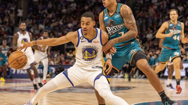 Oct 30, 2022; Detroit, Michigan, USA; Detroit Pistons guard Killian Hayes (7) defends against Golden State Warriors guard Jordan Poole (3) during the in the first half at Little Caesars Arena. Mandatory Credit: David Reginek-USA TODAY Sports