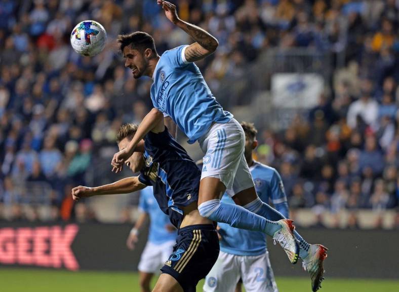 Oct 30, 2022; Philadelphia, Pennsylvania, USA; New York City defender Thiago Martins (5) heads the ball against Philadelphia Union defender Jack Elliott (3)  during the first half for the conference finals for the Audi 2022 MLS Cup Playoffs. Mandatory Credit: Vincent Carchietta-USA TODAY Sports