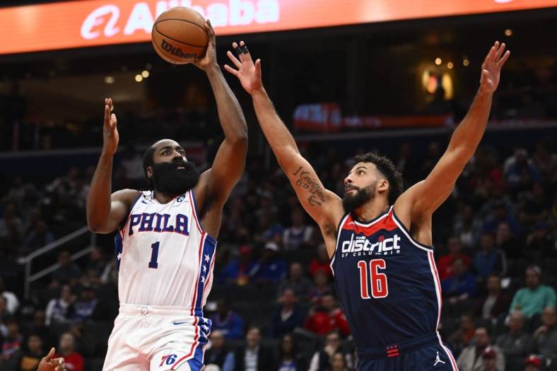 Oct 31, 2022; Washington, District of Columbia, USA; Philadelphia 76ers guard James Harden (1) shoots over Washington Wizards forward Anthony Gill (16) during the first half at Capital One Arena. Mandatory Credit: Brad Mills-USA TODAY Sports