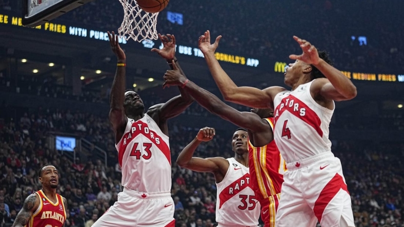 Oct 31, 2022; Toronto, Ontario, CAN; Toronto Raptors forward Pascal Siakam (43) and forward Scottie Barnes (4) go after a rebound against the Atlanta Hawks during the first quarter at Scotiabank Arena. Mandatory Credit: John E. Sokolowski-USA TODAY Sports