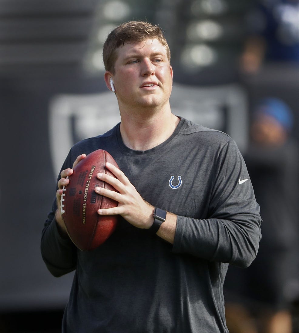 Parks Frazier, the Colts assistant coach, throws footballs to players before the start of their game against the Oakland Raiders at Oakland Alameda Coliseum in Oakland, CA., Sunday, Oct 28, 2018.

The Indianapolis Colts Play The Oakland Raiders