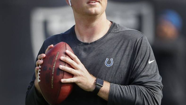 Parks Frazier, the Colts assistant coach, throws footballs to players before the start of their game against the Oakland Raiders at Oakland Alameda Coliseum in Oakland, CA., Sunday, Oct 28, 2018.

The Indianapolis Colts Play The Oakland Raiders