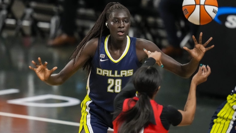 May 27, 2021; College Park, Georgia, USA; Dallas Wings center Awak Kuier (28) defends against the Atlanta Dream during the second half at Gateway Center Arena at College Park. Mandatory Credit: Dale Zanine-USA TODAY Sports