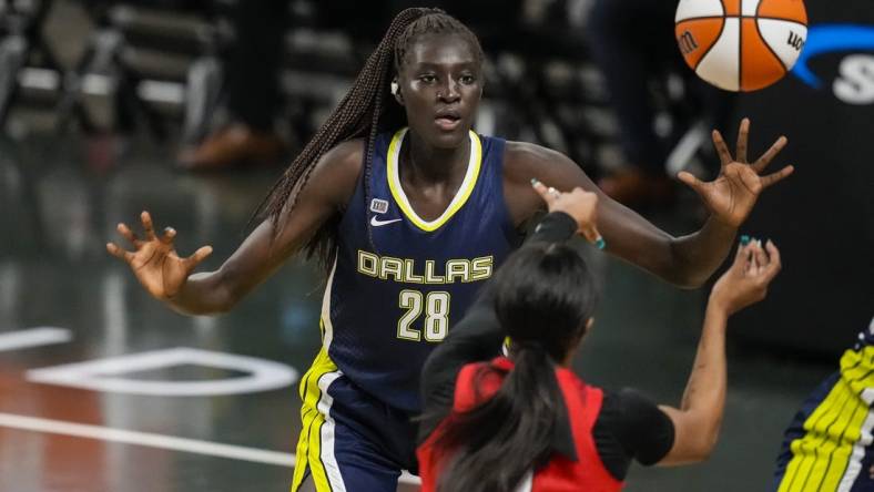 May 27, 2021; College Park, Georgia, USA; Dallas Wings center Awak Kuier (28) defends against the Atlanta Dream during the second half at Gateway Center Arena at College Park. Mandatory Credit: Dale Zanine-USA TODAY Sports