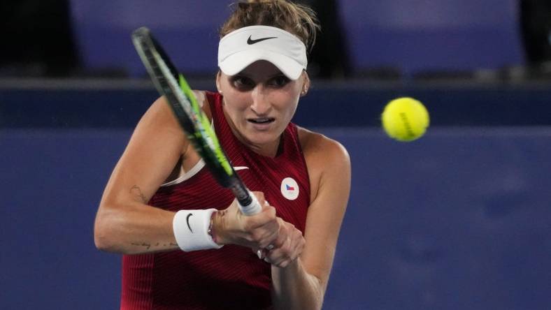 Jul 31, 2021; Tokyo, Japan; Marketa Vondrousova (CZE) in action against Belinda Bencic (SUI) in the women's gold medal match during the Tokyo 2020 Olympic Summer Games at Ariake Tennis Park. Mandatory Credit: Robert Deutsch-USA TODAY Sports