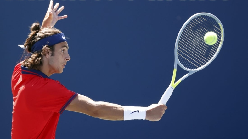 Sep 2, 2021; Flushing, NY, USA; Lorenzo Musetti of Italy hits a shot against Reilly Opelka of the United States in a second round match on day four of the 2021 U.S. Open tennis tournament at USTA Billie Jean King National Tennis Center. Mandatory Credit: Jerry Lai-USA TODAY Sports