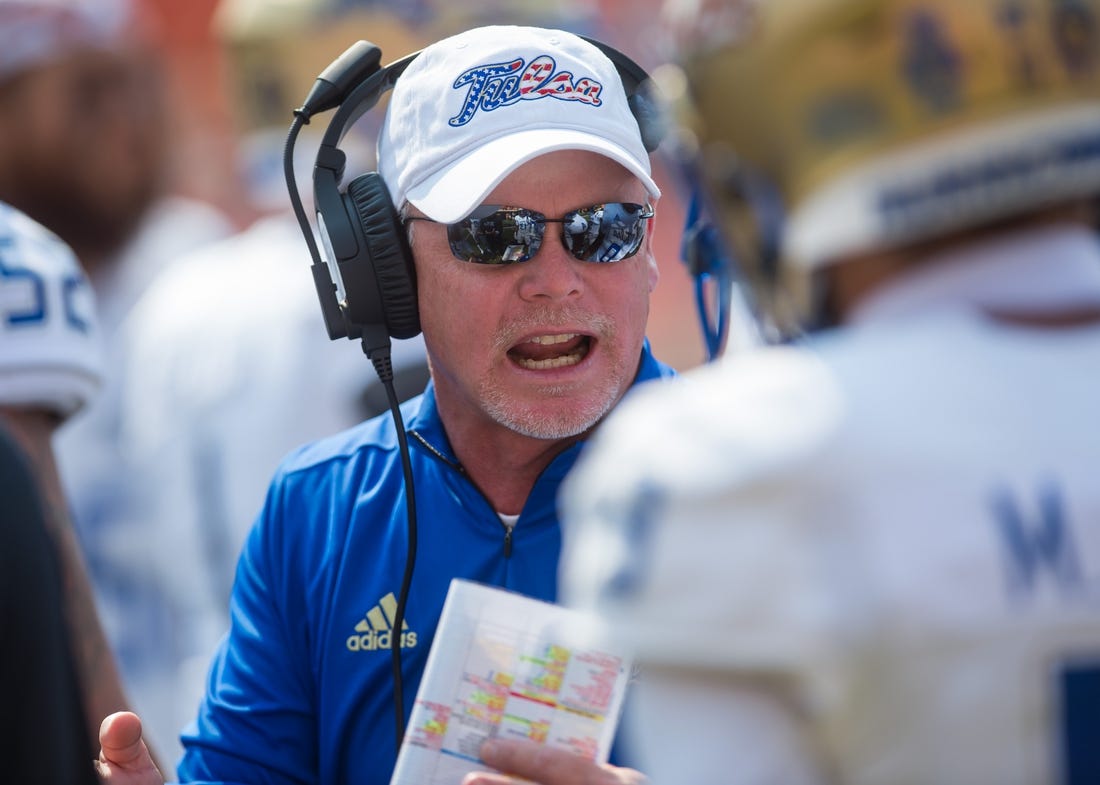 Sep 11, 2021; Stillwater, Oklahoma, USA;  Tulsa Golden Hurricane head coach Philip Montgomery talks to his players during a timeout in the first quarter against the Oklahoma State Cowboys at Boone Pickens Stadium. Mandatory Credit: Brett Rojo-USA TODAY Sports