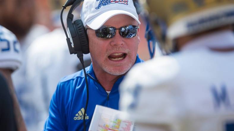 Sep 11, 2021; Stillwater, Oklahoma, USA;  Tulsa Golden Hurricane head coach Philip Montgomery talks to his players during a timeout in the first quarter against the Oklahoma State Cowboys at Boone Pickens Stadium. Mandatory Credit: Brett Rojo-USA TODAY Sports