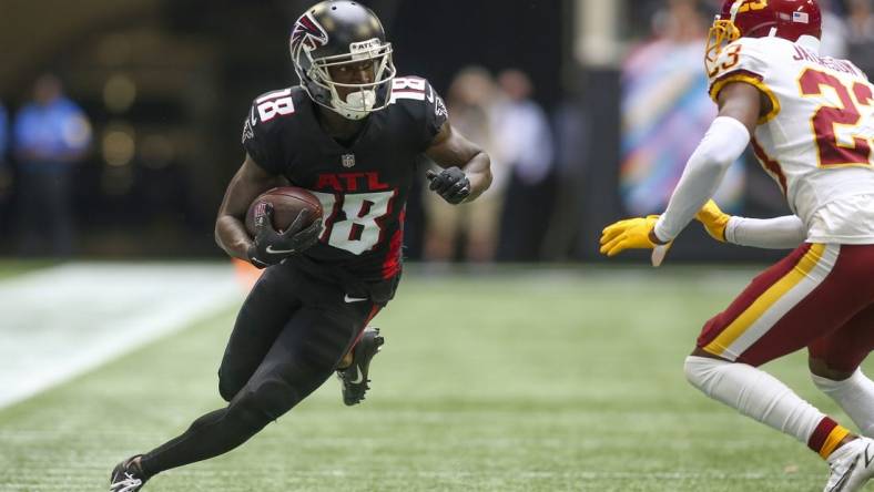 Oct 3, 2021; Atlanta, Georgia, USA; Atlanta Falcons wide receiver Calvin Ridley (18) runs after a catch against the Washington Football Team in the second quarter at Mercedes-Benz Stadium. Mandatory Credit: Brett Davis-USA TODAY Sports