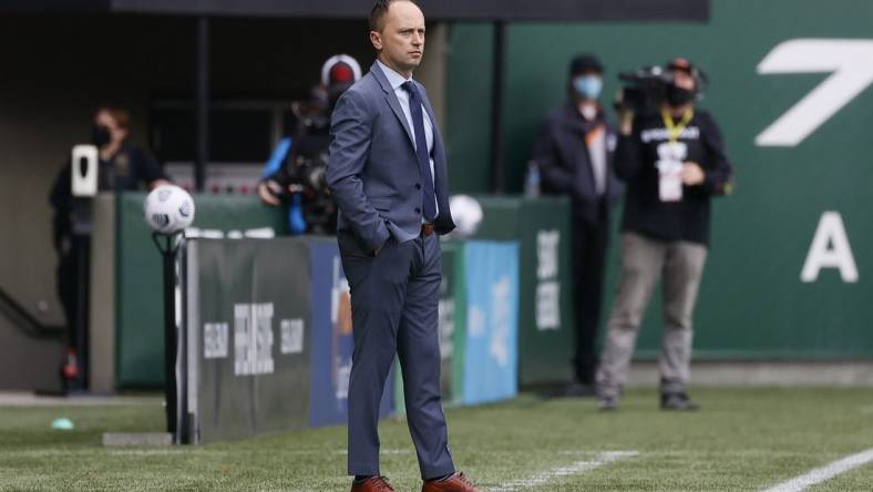 Nov 14, 2021; Portland, OR, USA; Portland Thorns head coach Mark Parsons watches his team from the sideline Chicago Red Stars during the first half of the NWSL semi final at Providence Park. Mandatory Credit: Soobum Im-USA TODAY Sports