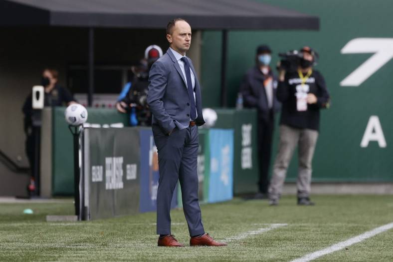 Nov 14, 2021; Portland, OR, USA; Portland Thorns head coach Mark Parsons watches his team from the sideline Chicago Red Stars during the first half of the NWSL semi final at Providence Park. Mandatory Credit: Soobum Im-USA TODAY Sports
