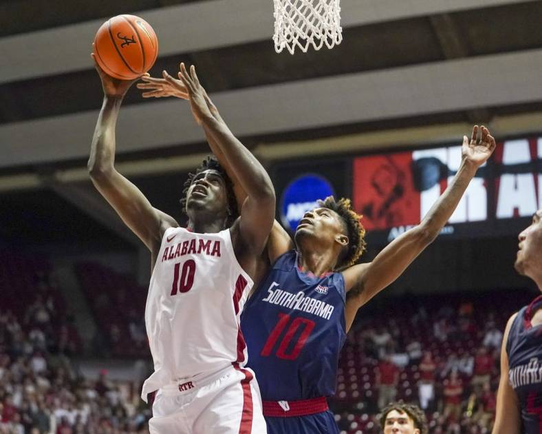 Nov 16, 2021; Tuscaloosa, Alabama, USA; Alabama Crimson Tide center Charles Bediako (10) shoot and is fouled by South Alabama Jaguars forward Diante Smith (10) during the second half at Coleman Coliseum. Mandatory Credit: Marvin Gentry-USA TODAY Sports