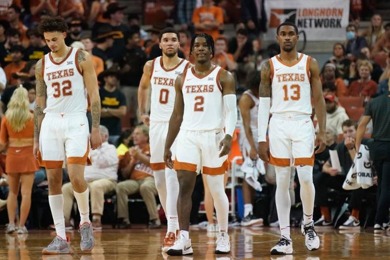 Nov 9, 2021; Austin, Texas, USA; Texas Longhorns forwards Christian Bishop (32) and Timmy Allen (0) along with guards Marcus Carr (2) and Jase Febres (13) during the first half against the Houston Baptist Huskies at Frank C. Erwin Jr. Center. Mandatory Credit: Scott Wachter-USA TODAY Sports